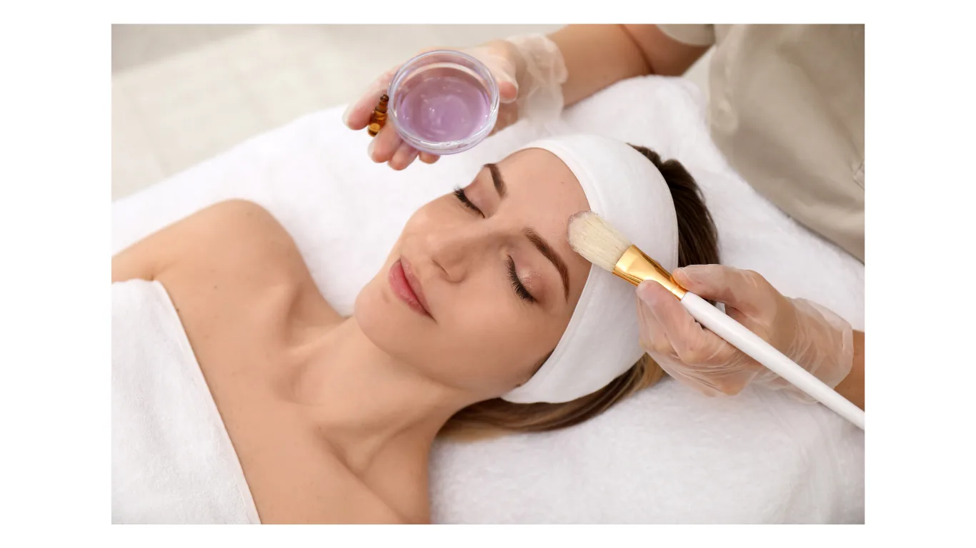 Medical aesthetician applying a professional facial peel